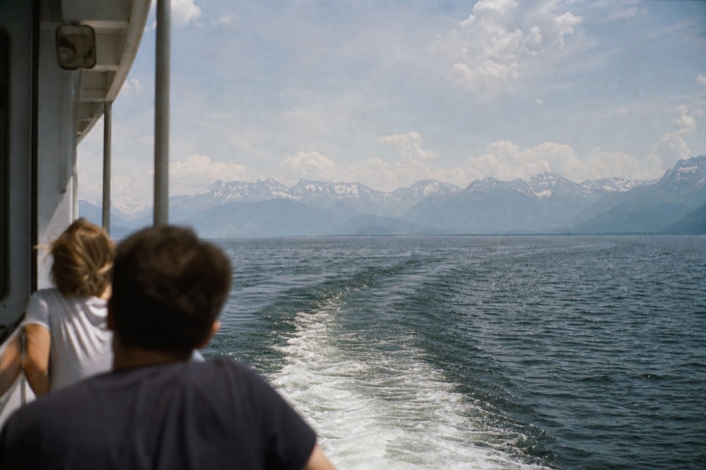 A paddle steamer crossing Lake Lucerne with mountains behind it, no text, no logos, no people