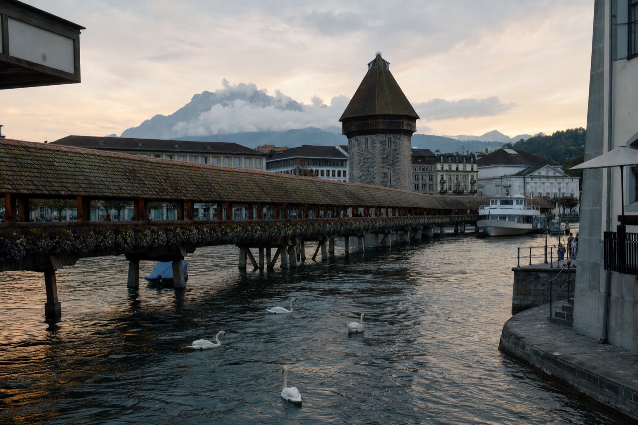 A paddle steamer crossing Lake Lucerne with mountains behind it, no text, no logos, no people.