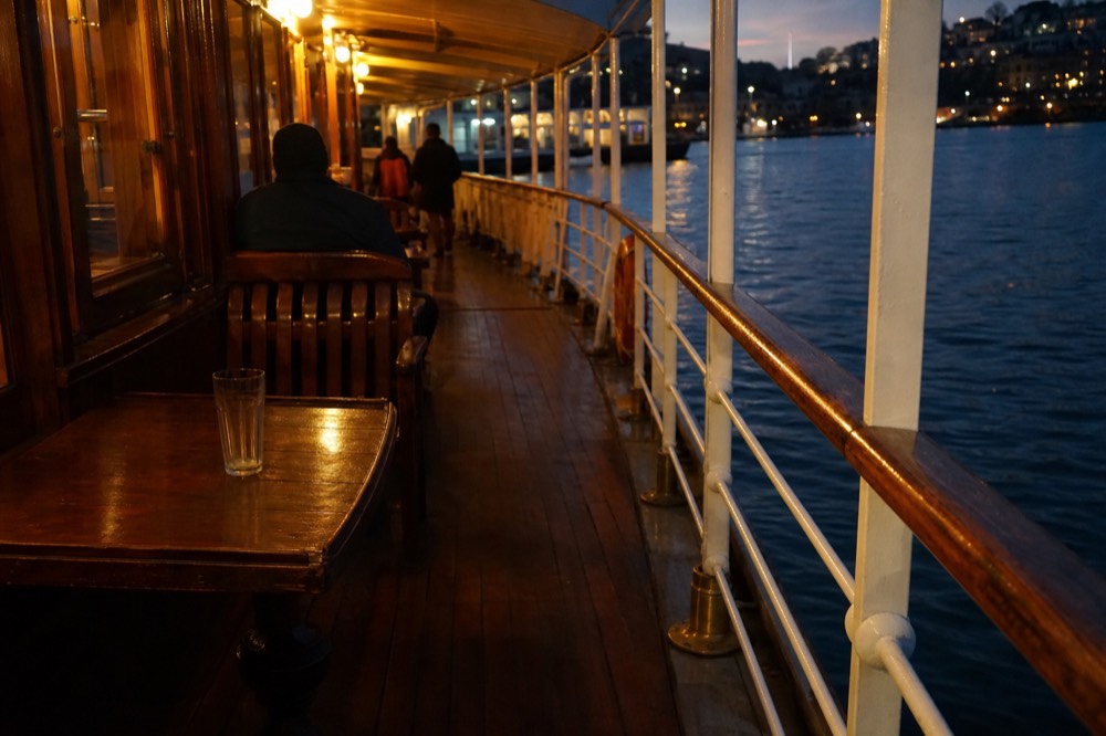 Wooden deck and brass fittings of a historic paddle steamer on Lake Lucerne, no text, no logos, no people